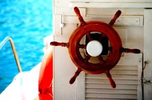 at the helm